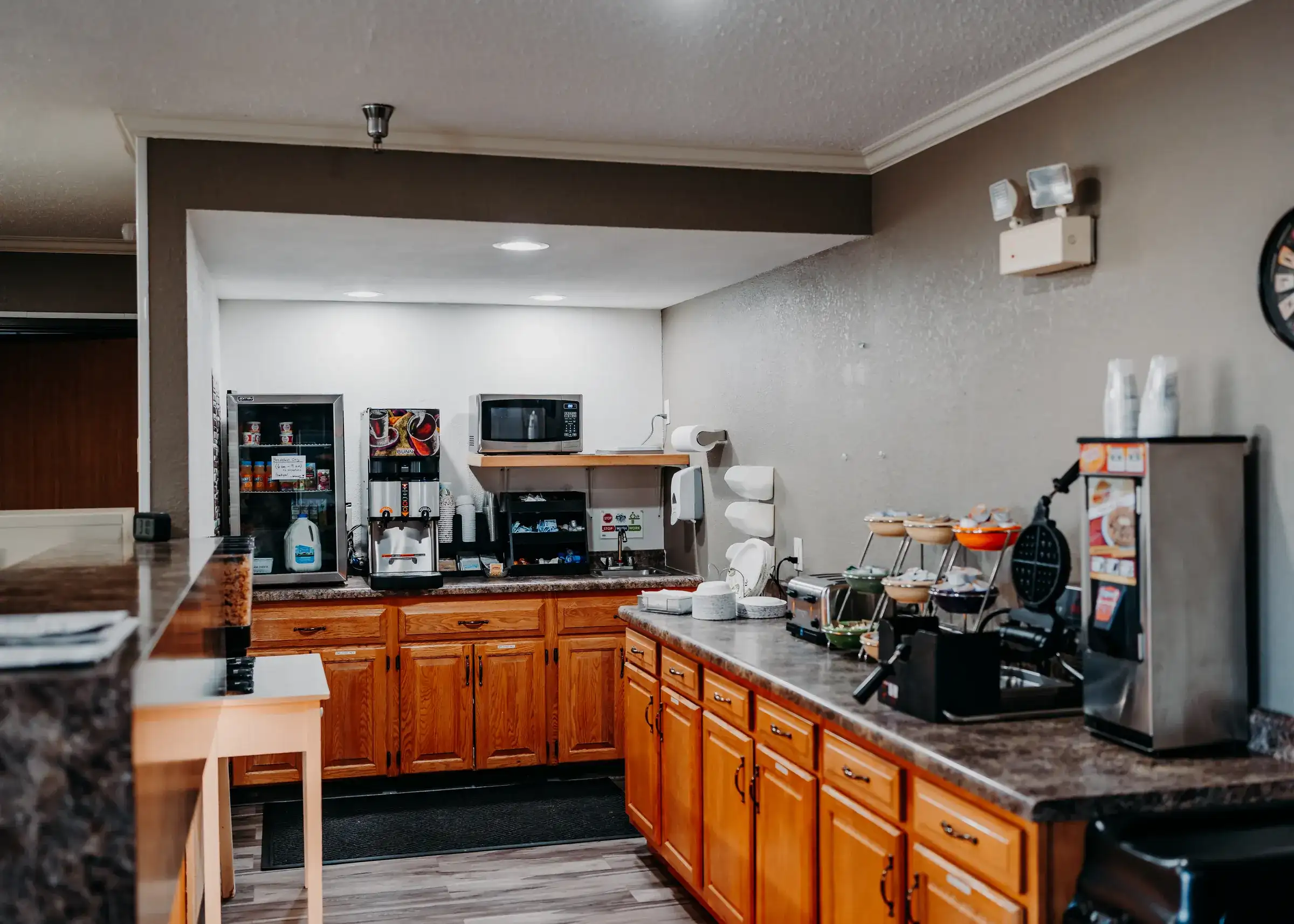 The free breakfast counter, with waffle maker, cereals and hot coffee